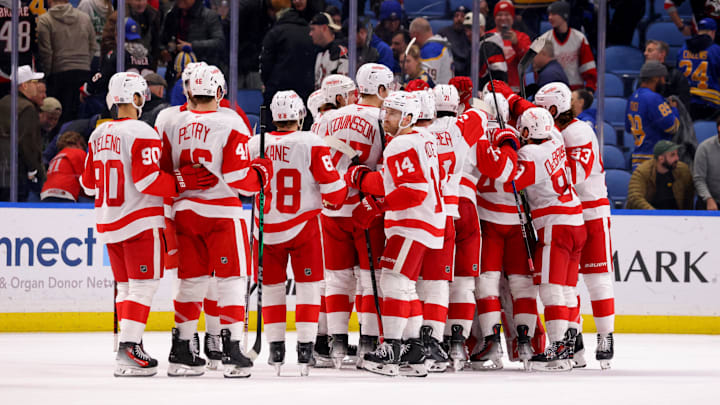 Dec 9, 2024; Buffalo, New York, USA;  The Detroit Red Wings celebrate a shootout win over the Buffalo Sabres at KeyBank Center. Mandatory Credit: Timothy T. Ludwig-Imagn Images
