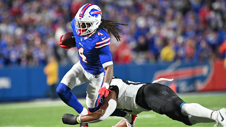 Sep 23, 2024; Orchard Park, New York, USA; Buffalo Bills running back James Cook (4) is tackled by Jacksonville Jaguars linebacker Ventrell Miller (51) in the third quarter at Highmark Stadium. Mandatory Credit: Mark Konezny-Imagn Images Sep 23, 2024; Orchard Park, New York, USA; Buffalo Bills running back James Cook (4) is tackled by Jacksonville Jaguars linebacker Ventrell Miller (51) in the third quarter at Highmark Stadium. Mandatory Credit: Mark Konezny-Imagn Images