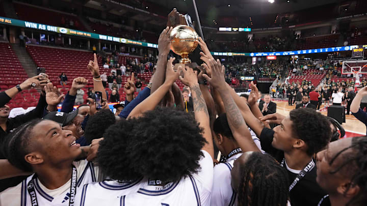Milwaukee Academy of Science players celebrate with the gold ball after winning the WIAA Division 3 boys basketball state championship on Saturday, March 22, 2025.