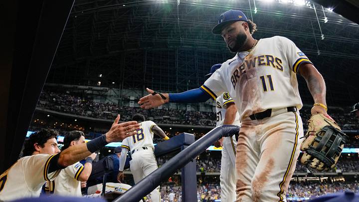 Sep 9, 2026; Milwaukee, Wisconsin, USA;  Milwaukee Brewers left fielder Jackson Chourio (11) is greeted by designated hitter Christian Yelich (22) after the top of the sixth inning against the Chicago Cubs at American Family Field. Mandatory Credit: Jeff Hanisch-Imagn Images