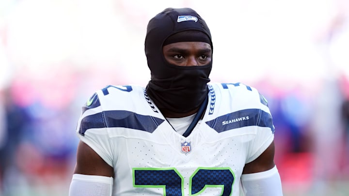 Dec 8, 2024; Glendale, Arizona, USA; Seattle Seahawks safety Jerrick Reed II (32) warms up before the game against the Arizona Cardinals at State Farm Stadium. Mandatory Credit: Joe Camporeale-Imagn Images