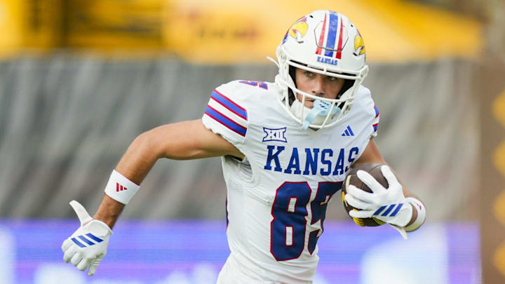 Sep 6, 2025; Columbia, Missouri, USA; Kansas Jayhawks wide receiver Tate Nagy (85) runs with the ball during the first half against the Missouri Tigers at Faurot Field at Memorial Stadium. Mandatory Credit: Jay Biggerstaff-Imagn Images