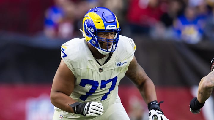 Nov 26, 2023; Glendale, Arizona, USA; Los Angeles Rams offensive tackle Alaric Jackson (77) against the Arizona Cardinals at State Farm Stadium. Mandatory Credit: Mark J. Rebilas-Imagn Images