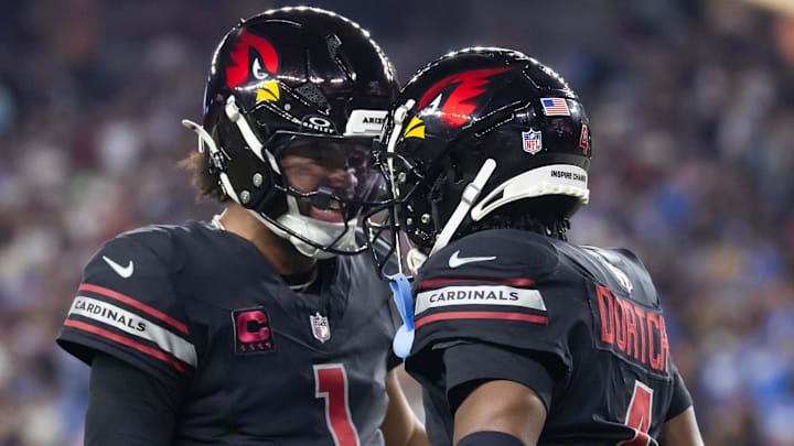 Oct 21, 2024; Glendale, Arizona, USA; Arizona Cardinals wide receiver Greg Dortch (4) celebrates a touchdown pass with quarterback Kyler Murray (1) against the Los Angeles Chargers in the first half at State Farm Stadium. Mandatory Credit: Mark J. Rebilas-Imagn Images Oct 21, 2024; Glendale, Arizona, USA; Arizona Cardinals wide receiver Greg Dortch (4) celebrates a touchdown pass with quarterback Kyler Murray (1) against the Los Angeles Chargers in the first half at State Farm Stadium. Mandatory Credit: Mark J. Rebilas-Imagn Images