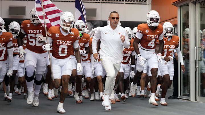 Sep 6, 2025; Austin, Texas, USA; Texas Longhorns head coach Steve Sarkisian leads players on to the field before the game against the San Jose State Spartans at Darrell K Royal-Texas Memorial Stadium. Mandatory Credit: Scott Wachter-Imagn Images