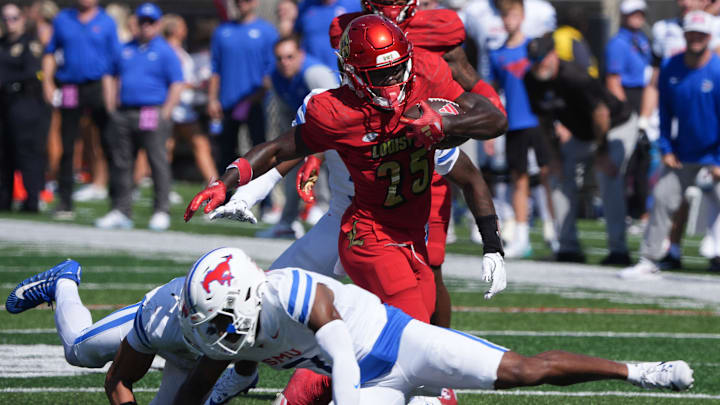 Louisville’s Issac Brown gets a first down against SMU this Saturday.
Oct. 5, 2024