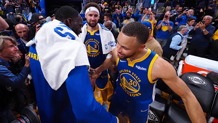 Mar 14, 2022; San Francisco, California, USA; Golden State Warriors forward Draymond Green celebrates with guards Klay Thompson and Stephen Curry. Mar 14, 2022; San Francisco, California, USA; Golden State Warriors forward Draymond Green celebrates with guards Klay Thompson and Stephen Curry.