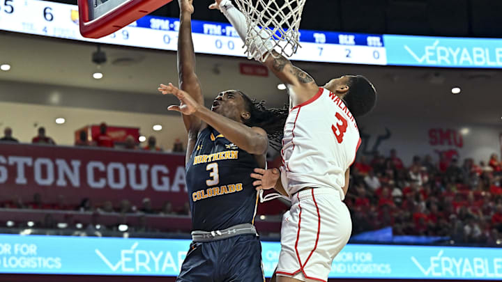 Nov 7, 2022; Houston, Texas, USA; Houston Cougars guard Ramon Walker Jr. (3) blocks a lay-up from Northern Colorado Bears guard Langston Reynolds (3) during the first half at Fertitta Center. Mandatory Credit: Maria Lysaker-Imagn Images