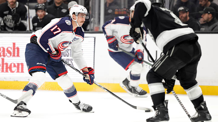 Blue Jackets forward Mason Marchment stickhandles against Kings defenseman Drew Doughty. Blue Jackets forward Mason Marchment stickhandles against Kings defenseman Drew Doughty.