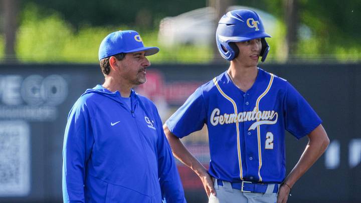 Germantown head coach Jay Wojcinski talks with Parker Zobel (2) at third base during a non-conference game versus Kettle Moraine at DockHounds Stadium on May 28, 2026. Germantown head coach Jay Wojcinski talks with Parker Zobel (2) at third base during a non-conference game versus Kettle Moraine at DockHounds Stadium on May 28, 2026.
