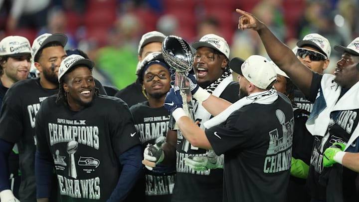Feb 8, 2026; Santa Clara, CA, USA;  Seattle Seahawks players celebrate with the Vince Lombardi Trophy after defeating the New England Patriots in Super Bowl LX at Levi's Stadium. Mandatory Credit: Kirby Lee-Imagn Images