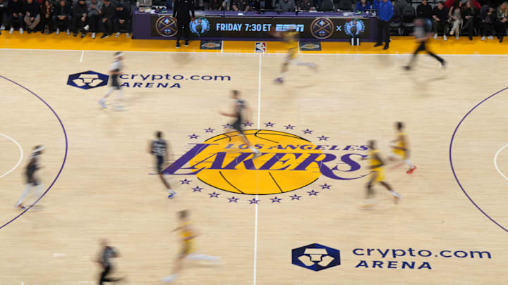 Jan 17, 2024; Los Angeles, California, USA; The Los Angeles Lakers logo at center court during the game against the Dallas Mavericks at the Crypto.com Arena. Mandatory Credit: Kirby Lee-Imagn Images Jan 17, 2024; Los Angeles, California, USA; The Los Angeles Lakers logo at center court during the game against the Dallas Mavericks at the Crypto.com Arena. Mandatory Credit: Kirby Lee-Imagn Images