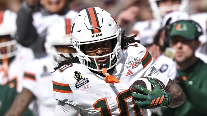 Dec 20, 2025; College Station, TX, USA; Miami Hurricanes wide receiver Malachi Toney (10) runs the ball during the first half against the Texas A&M Aggies at Kyle Field. Mandatory Credit: Maria Lysaker-Imagn Images