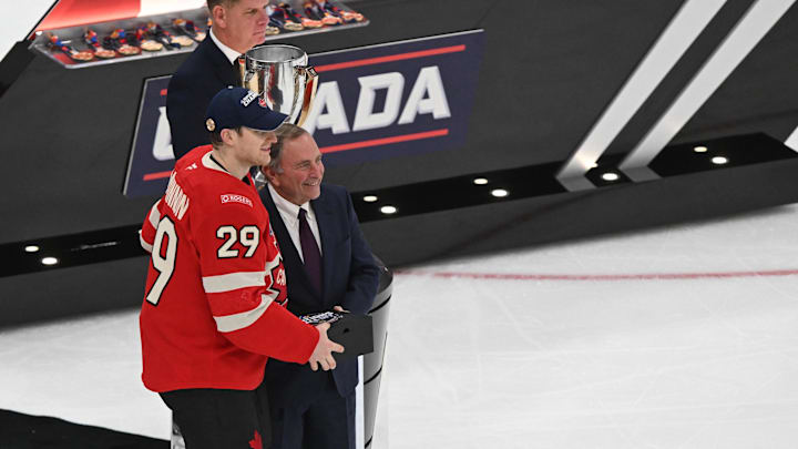 Feb 20, 2025; Boston, MA, USA; [Imagn Images direct customers only]  Team Canada forward Nathan MacKinnon (29) receives the Most Valuable Player award from NHL commissioner Gary Bettman after the win against Team USA during the 4 Nations Face-Off ice hockey championship game at TD Garden. Mandatory Credit: Brian Fluharty-Imagn Images