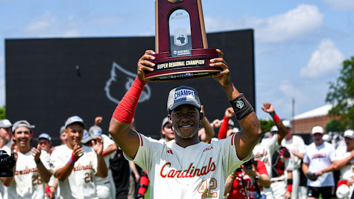 Louisville baseball players celebrate after defeating Miami in game three of the 2025 Louisville Super Regional.