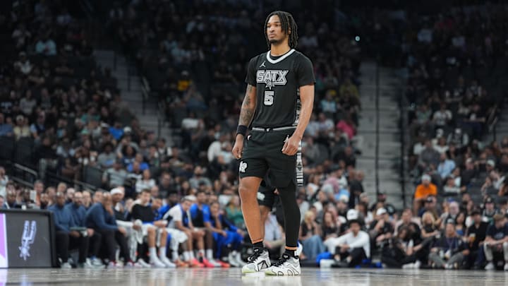 Apr 1, 2025; San Antonio, Texas, USA;  San Antonio Spurs guard Stephon Castle (5) looks on in the first half against the Orlando Magic at Frost Bank Center. Mandatory Credit: Daniel Dunn-Imagn Images