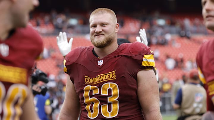 Washington Commanders center Tyler Biadasz (63) walks off the field after the game Washington Commanders center Tyler Biadasz (63) walks off the field after the game