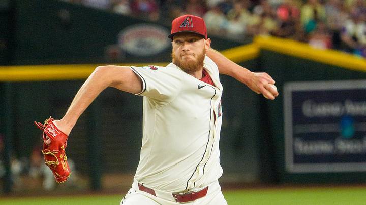 Apr 13, 2025; Phoenix, Arizona, USA;  Arizona Diamondbacks pitcher A.J. Puk (33) comes in to close in the ninth inning against the Milwaukee Brewers at Chase Field. Mandatory Credit: Allan Henry-Imagn Images