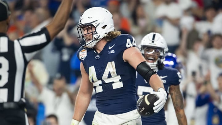 Dec 31, 2024; Glendale, AZ, USA; Penn State Nittany Lions tight end Tyler Warren (44) celebrates after scoring a touchdown against the Boise State Broncos in the Fiesta Bowl at State Farm Stadium. Mandatory Credit: Mark J. Rebilas-Imagn Images Dec 31, 2024; Glendale, AZ, USA; Penn State Nittany Lions tight end Tyler Warren (44) celebrates after scoring a touchdown against the Boise State Broncos in the Fiesta Bowl at State Farm Stadium. Mandatory Credit: Mark J. Rebilas-Imagn Images