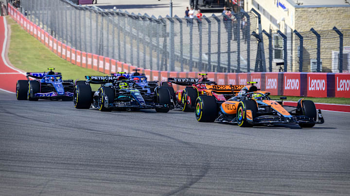 Oct 22, 2023; Austin, Texas, USA; McLaren F1 driver Lando Norris (4) of Team Great Britain and Mercedes AMG Petronas Motorsport driver Lewis Hamilton (44) of Team Great Britain and Scuderia Ferrari driver Carlos Sainz (55) of Team Spain drives during the 2023 United States Grand Prix at Circuit of the Americas. Mandatory Credit: Jerome Miron-USA TODAY Sports