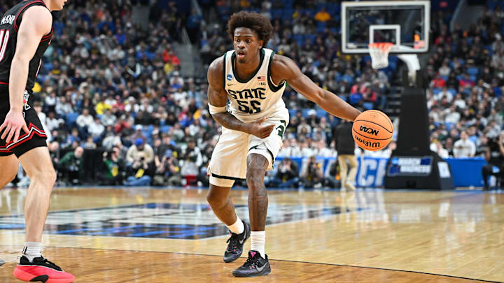 Mar 21, 2026; Buffalo, NY, USA; Michigan State Spartans forward Coen Carr (55) controls the ball in the first half against the Louisville Cardinals during a second round game of the men's 2026 NCAA Tournament at Keybank Center. Mandatory Credit: Mark Konezny-Imagn Images