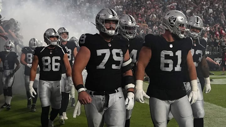 Aug 23, 2024; Paradise, Nevada, USA; Las Vegas Raiders guard Ben Brown (79) and guard Jordan Meredith (61) enter the field before the game against the San Francisco 49ers at Allegiant Stadium. Mandatory Credit: Kirby Lee-Imagn Images