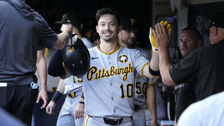 Aug 13, 2025; Milwaukee, Wisconsin, USA; Pittsburgh Pirates outfielder Bryan Reynolds (10) celebrates in the dugout after hitting a home run against the Milwaukee Brewers in the sixth inning at American Family Field. Mandatory Credit: Michael McLoone-Imagn Images