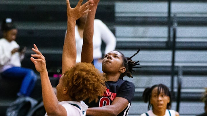 Williston Red Devils Ashlyn Young (0) shoots for two in the second half. The West Port Wolf Pack hosted the Williston Red Devils at West Port High School in Ocala, FL on Thursday, December 5, 2024. The Red Devils defeated the Wolf Pack 61-55. [Doug Engle/Ocala Star Banner]
