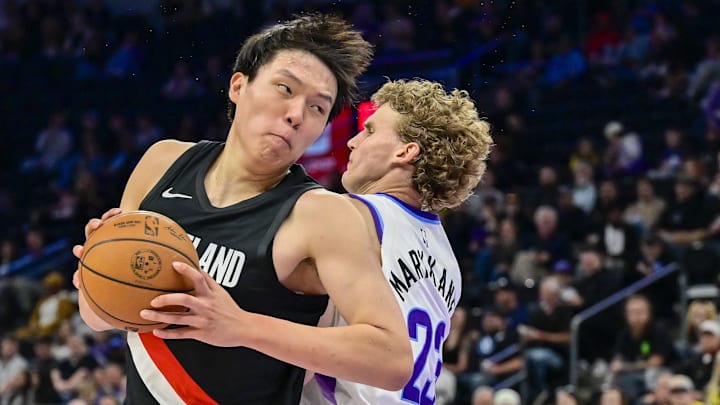 Oct 16, 2025; Salt Lake City, Utah, USA: Utah Jazz forward/center Lauri Markkanen (23) guards Portland Trail Blazers center Yang Hansen (16) during the first half at Delta Center. Mandatory Credit: Peter Creveling-Imagn Images Oct 16, 2025; Salt Lake City, Utah, USA: Utah Jazz forward/center Lauri Markkanen (23) guards Portland Trail Blazers center Yang Hansen (16) during the first half at Delta Center. Mandatory Credit: Peter Creveling-Imagn Images