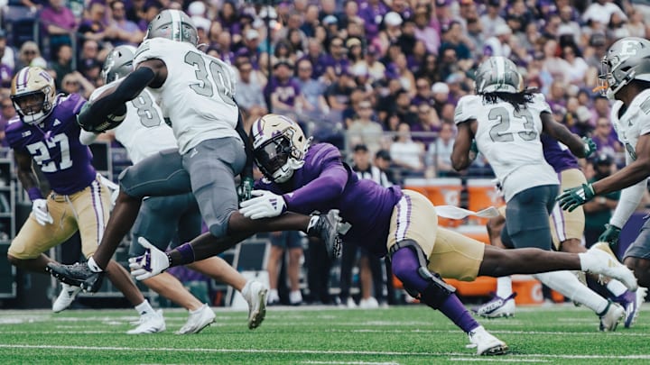 Justin Harrington attempts to make a special-teams tackle for the UW against Eastern Michigan. Justin Harrington attempts to make a special-teams tackle for the UW against Eastern Michigan.