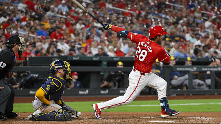 Sep 19, 2025; St. Louis, Missouri, USA;  St. Louis Cardinals third baseman Nolan Arenado (28) hits a three run double against the Milwaukee Brewers during the fifth inning at Busch Stadium. Mandatory Credit: Jeff Curry-Imagn Images