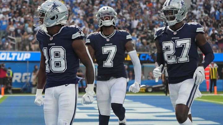 Former Dallas Cowboys strong safety Damontae Kazee (18), cornerback Trevon Diggs (7), and safety Jayron Kearse (27) celebrate at SoFi Stadium.