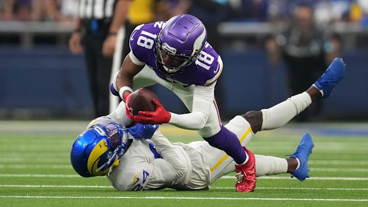 Oct 24, 2024; Inglewood, California, USA; Minnesota Vikings wide receiver Justin Jefferson (18) is tackled by Los Angeles Rams cornerback Darious Williams (24) in the first half at SoFi Stadium. Mandatory Credit: Kirby Lee-Imagn Images