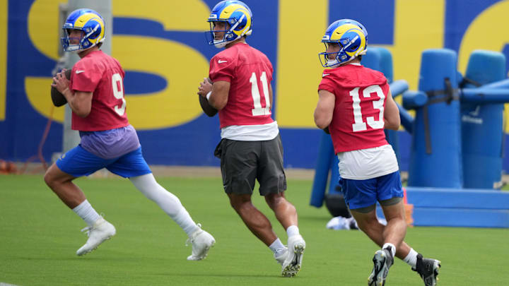 May 28, 2025; Woodland Hills, CA, USA; Los Angeles Rams quarterbacks Matthew Stafford (9), Jimmy Garoppolo (11) and Stetson Bennett (13) throw the ball during organized team activities at Rams Practice Facility. Mandatory Credit: Kirby Lee-Imagn Images