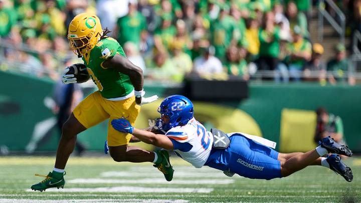 Sep 5, 2026; Eugene, Oregon, USA; Oregon Ducks running back Jordon Davison (0) breaks a tackle during the second half against Boise State Broncos defensive back Roman Tillmon (22) at Autzen Stadium. Mandatory Credit: Troy Wayrynen-Imagn Images