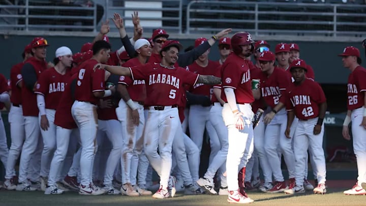 Alabama baseball outfielder Richie Bonomolo Jr. (5) and teammates celebrate in a game against Jacksonville State. Alabama baseball outfielder Richie Bonomolo Jr. (5) and teammates celebrate in a game against Jacksonville State.