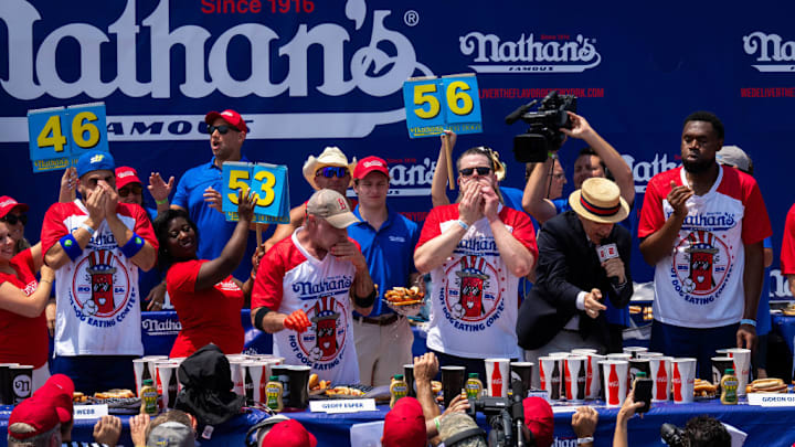 Participants compete at the Nathan's Hot Dog Eating Contest on July 4, 2024.