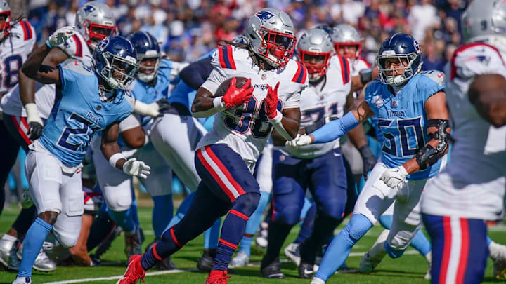 The Tennessee Titans defense scrambles for a stop against the New England Patriots The Tennessee Titans defense scrambles for a stop against the New England Patriots