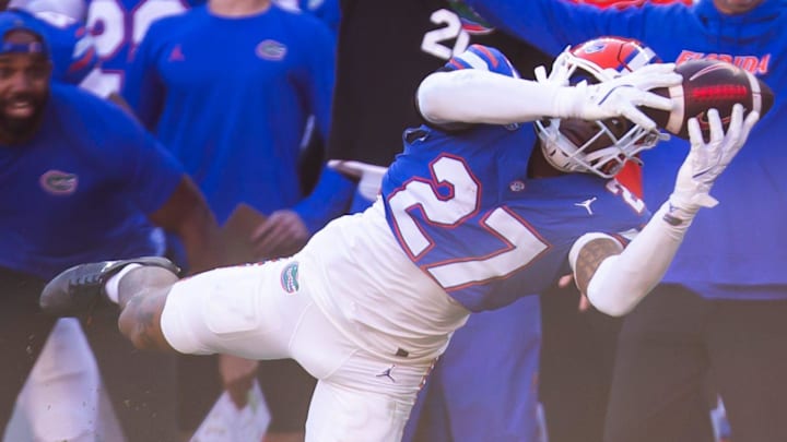 Florida Gators defensive back Dijon Johnson (27) intercepts the ball but was called back during the second half at Ben Hill Griffin Stadium in Gainesville, FL on Saturday, November 23, 2024. The Gators defeated the Rebels 24-17 [Doug Engle/Gainesville Sun]