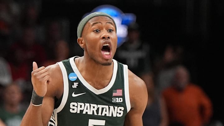 Mar 30, 2025; Atlanta, GA, USA; Michigan State Spartans guard Tre Holloman (5) yells to teammates during the first half in the South Regional final of the 2025 NCAA tournament against the Auburn Tigers at State Farm Arena. Mandatory Credit: Dale Zanine-Imagn Images Mar 30, 2025; Atlanta, GA, USA; Michigan State Spartans guard Tre Holloman (5) yells to teammates during the first half in the South Regional final of the 2025 NCAA tournament against the Auburn Tigers at State Farm Arena. Mandatory Credit: Dale Zanine-Imagn Images