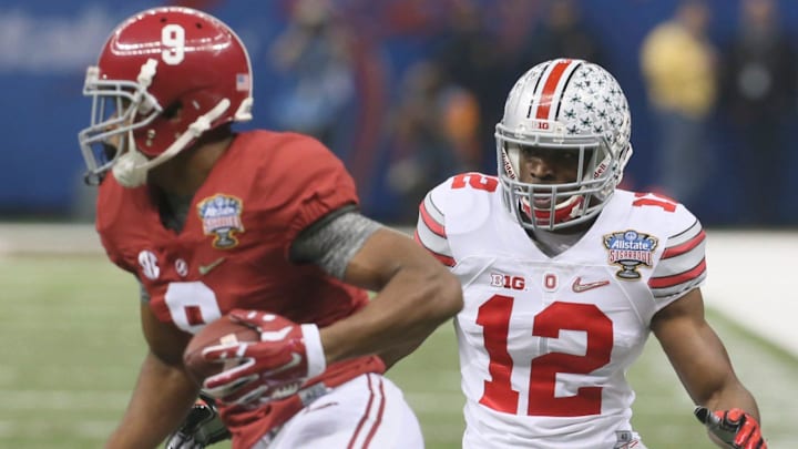 Ohio State's Doran Grant moves in to make a tackle on Alabama's Amari Cooper in the first quarter of the Sugar Bowl, Thursday, Jan. 1, 2015, in New Orleans.