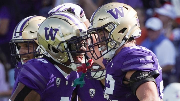 Carson Bruener and the departed Jaivion Green celebrate a play against Boise State. 