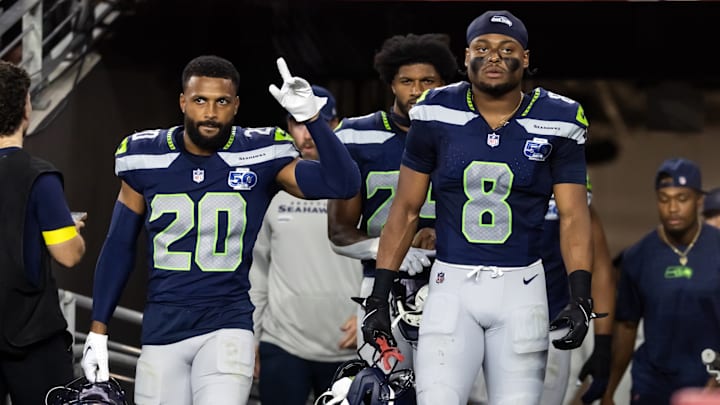 Sep 25, 2025; Glendale, Arizona, USA; Seattle Seahawks safety Julian Love (20) and Coby Bryant (8) against the Arizona Cardinals at State Farm Stadium. 