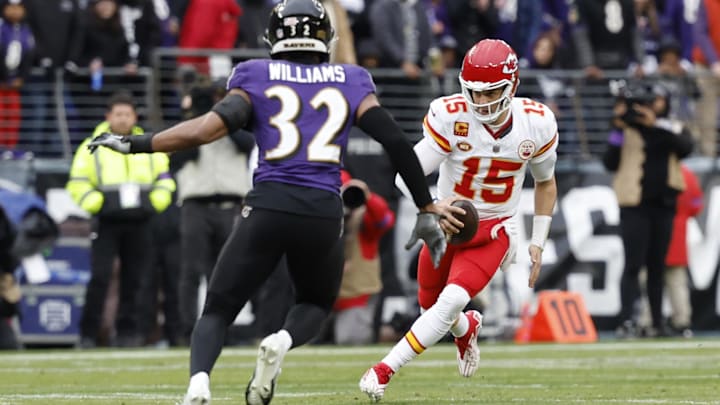 Jan 28, 2024; Baltimore, Maryland, USA; Kansas City Chiefs quarterback Patrick Mahomes (15) runs with the ball as Baltimore Ravens safety Marcus Williams (32) defends in the AFC Championship football game at M&T Bank Stadium. Mandatory Credit: Geoff Burke-Imagn Images