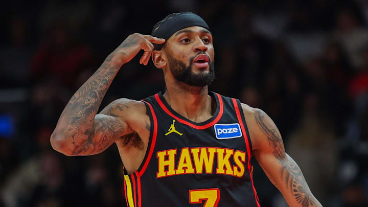 Nov 28, 2025; Atlanta, Georgia, USA; Atlanta Hawks guard Nickeil Alexander-Walker (7) celebrates a three point shot against the Cleveland Cavaliers during the first quarter at State Farm Arena. Mandatory Credit: Jordan Godfree-Imagn Images