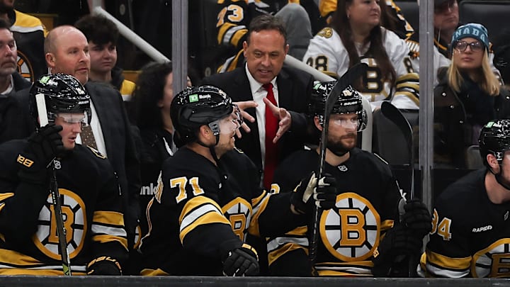 Oct 28, 2025; Boston, Massachusetts, USA; Boston Bruins head coach Marco Sturm talks with left wing Viktor Arvidsson (71) during the second period against the New York Islanders at TD Garden. Mandatory Credit: Winslow Townson-Imagn Images