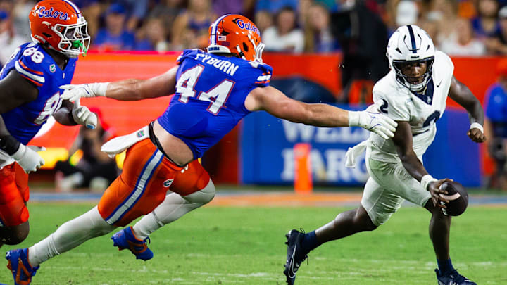 Florida Gators edge Jack Pyburn (44) chases down Samford Bulldogs quarterback Quincy Crittendon (2) during the first half at Ben Hill Griffin Stadium in Gainesville, FL on Saturday, September 7, 2024 against the Samford Bulldogs. The Gators lead 14-0 at the half. [Doug Engle/Gainesville Sun]