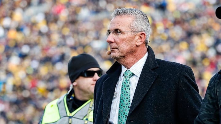 Nov 25, 2023; Ann Arbor, MI, USA;  Ohio State Buckeyes former head coach Urban Meyer walks by the end zone during the first half between Michigan and Ohio State at Michigan Stadium in Ann Arbor on Saturday, Nov. 25, 2023. 