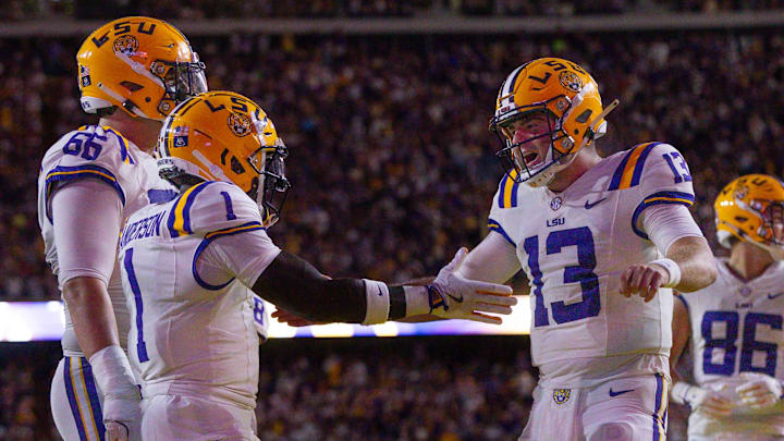 Sep 28, 2024; Baton Rouge, Louisiana, USA; LSU Tigers wide receiver Aaron Anderson (1) celebrates a touchdown with quarterback Garrett Nussmeier (13) against the South Alabama Jaguars during the first quarter at Tiger Stadium. Mandatory Credit: Stephen Lew-Imagn Images Sep 28, 2024; Baton Rouge, Louisiana, USA; LSU Tigers wide receiver Aaron Anderson (1) celebrates a touchdown with quarterback Garrett Nussmeier (13) against the South Alabama Jaguars during the first quarter at Tiger Stadium. Mandatory Credit: Stephen Lew-Imagn Images