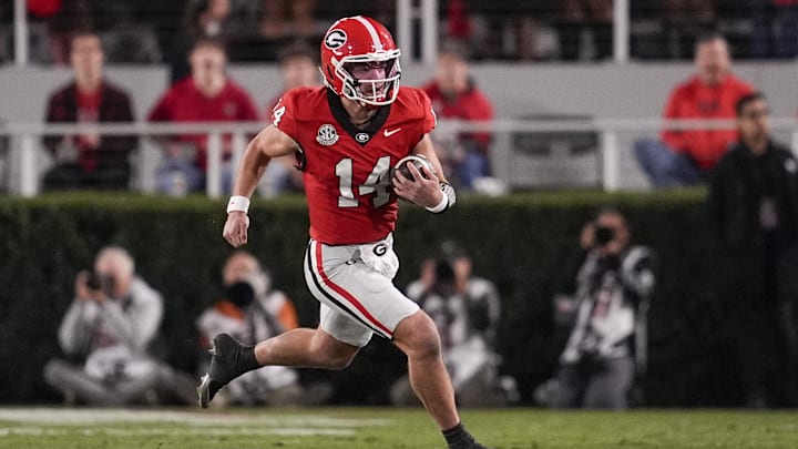 Nov 15, 2025; Athens, Georgia, USA; Georgia Bulldogs quarterback Gunner Stockton (14) runs the ball in the first half against the Texas Longhorns at Sanford Stadium. Mandatory Credit: Dale Zanine-Imagn Images